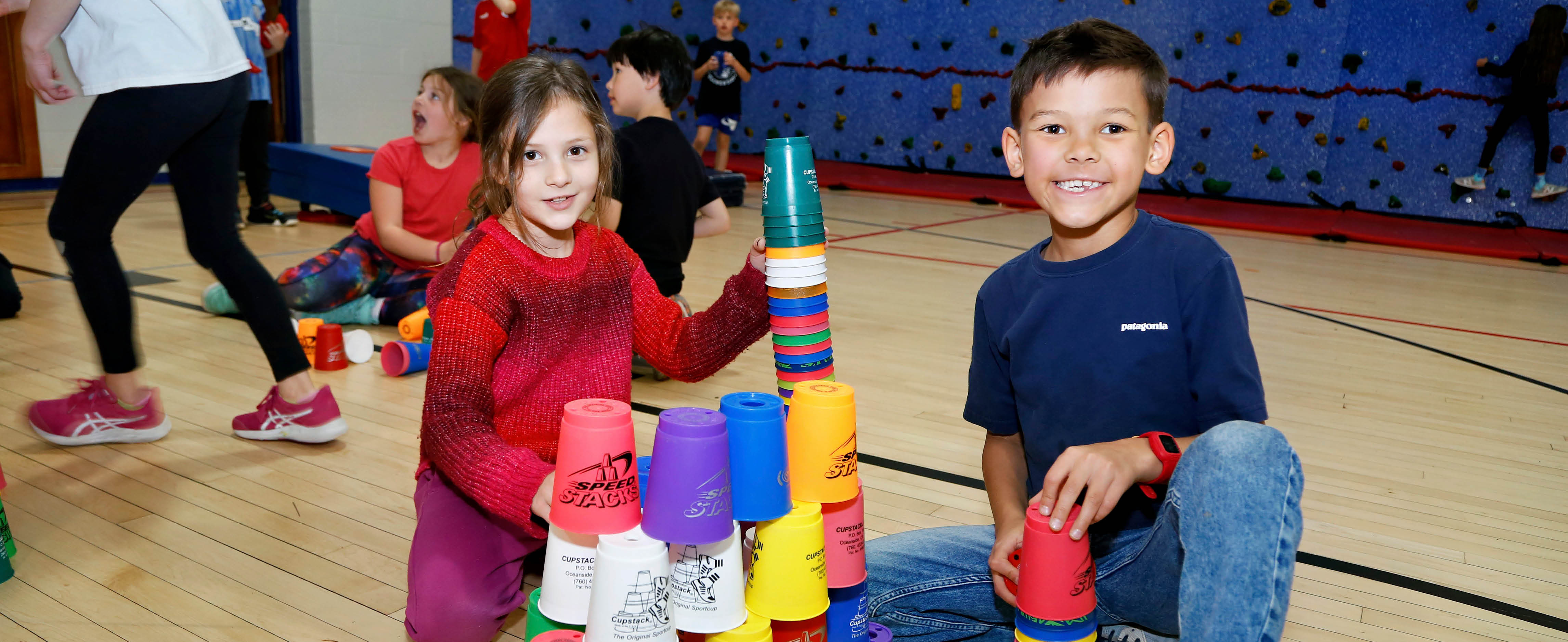 Students stacking cups