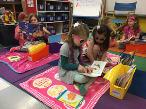 students reading in class during tropical day