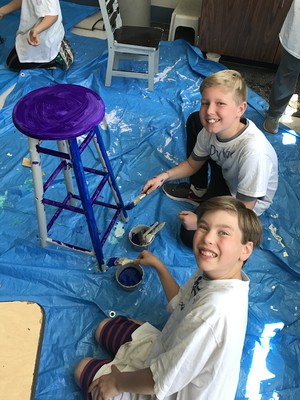 students refurbishing furniture