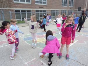 students blowing bubbles