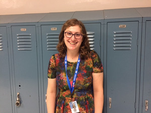teacher standing in front of lockers