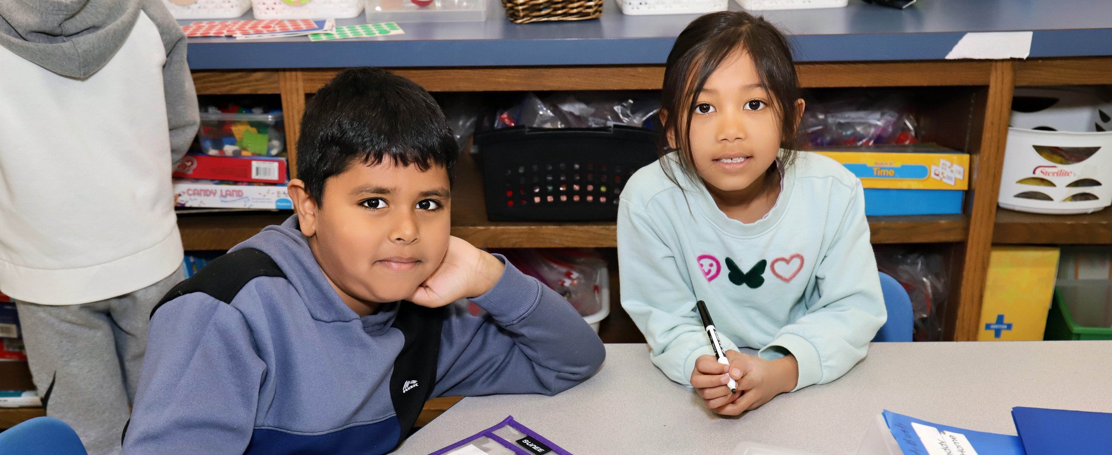 Two students at a table