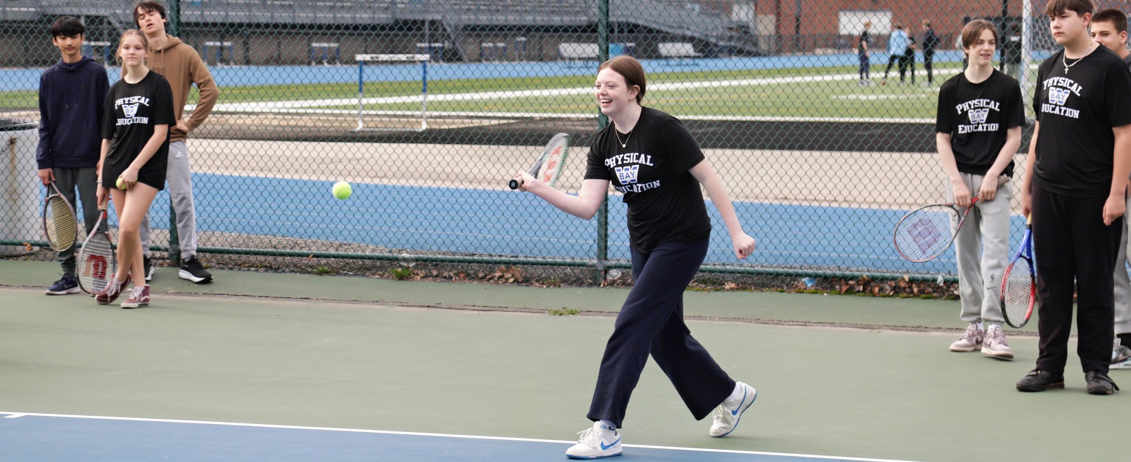 Learner playing tennis