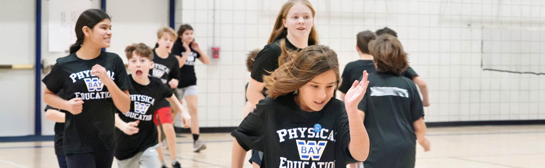 Students running in PE