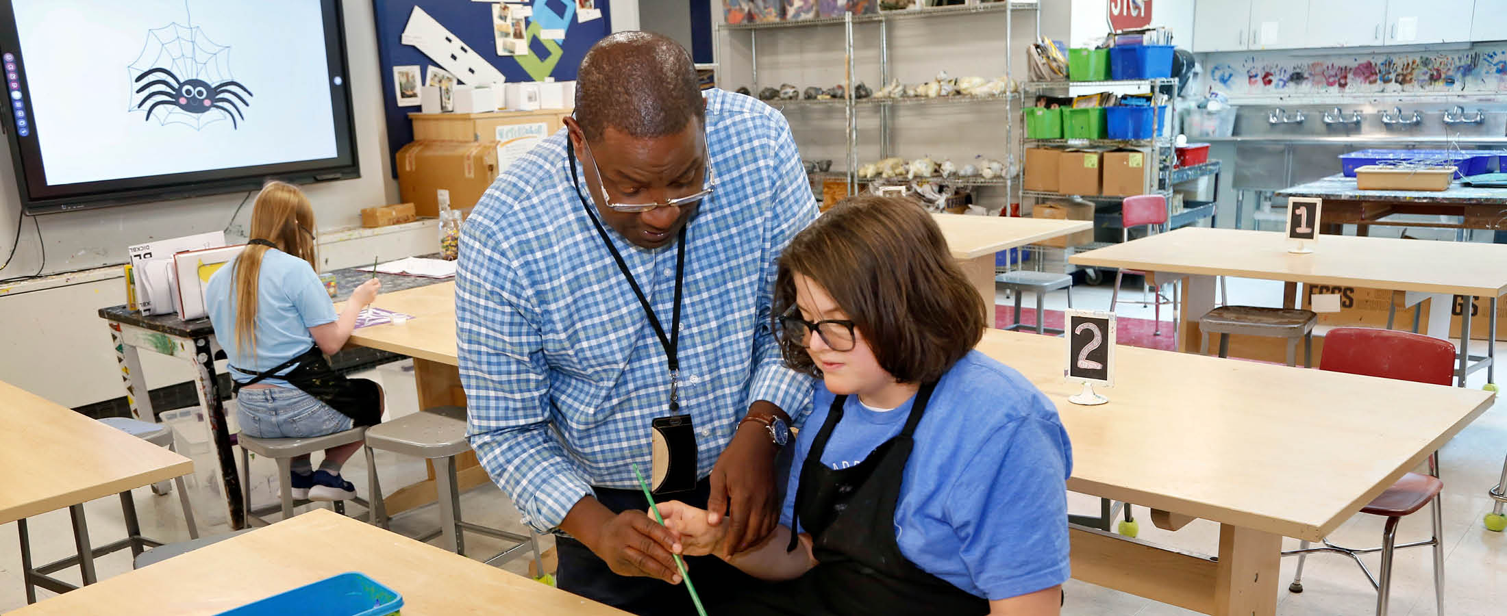Student and teacher working together