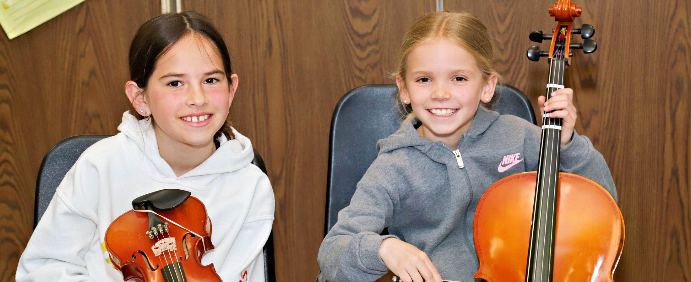 Two students playing instruments