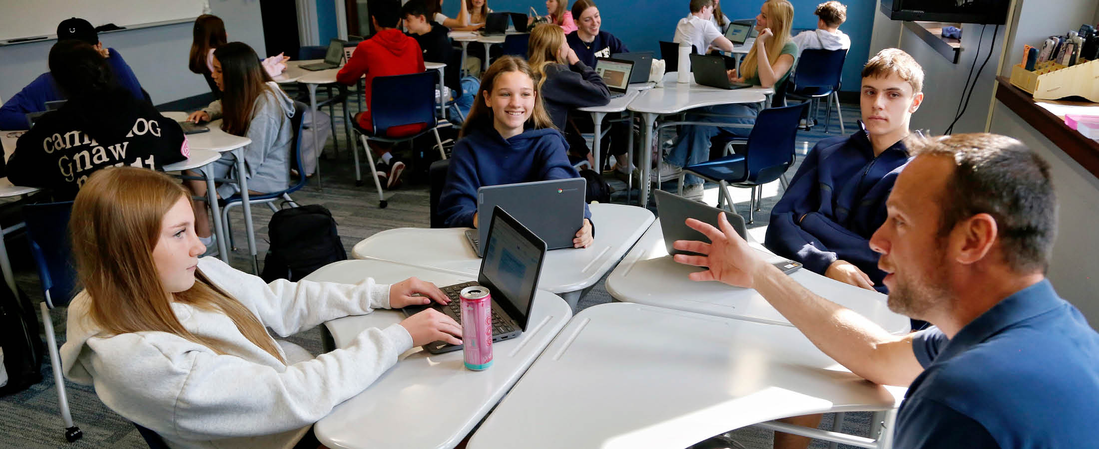 High School students working with teacher
