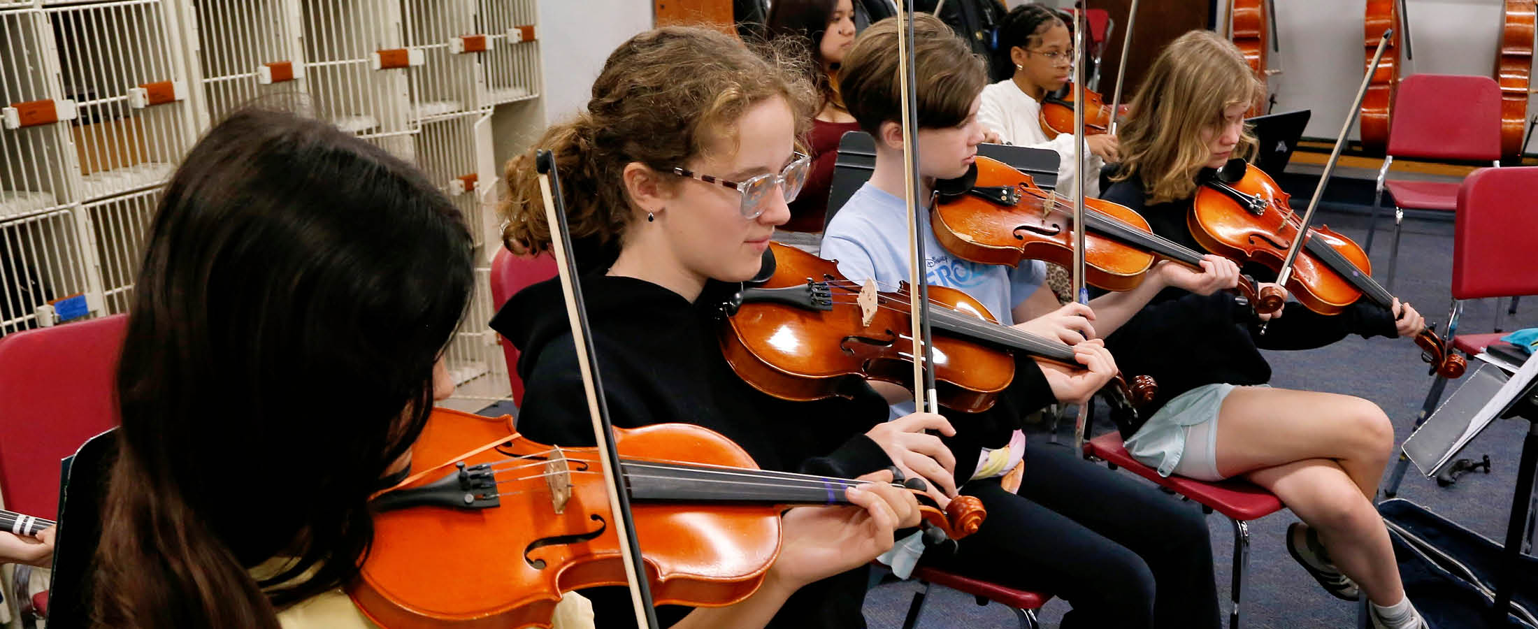 Students playing violins