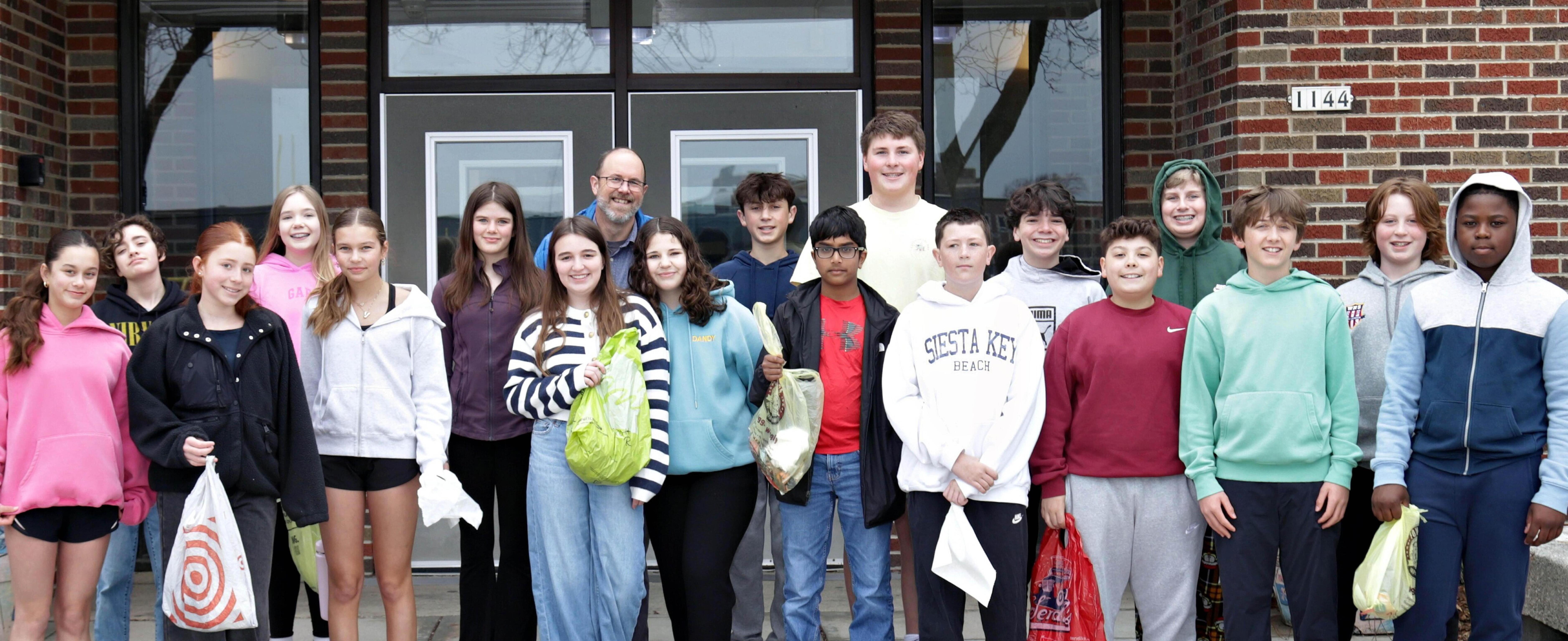 Middle School students in front of the building