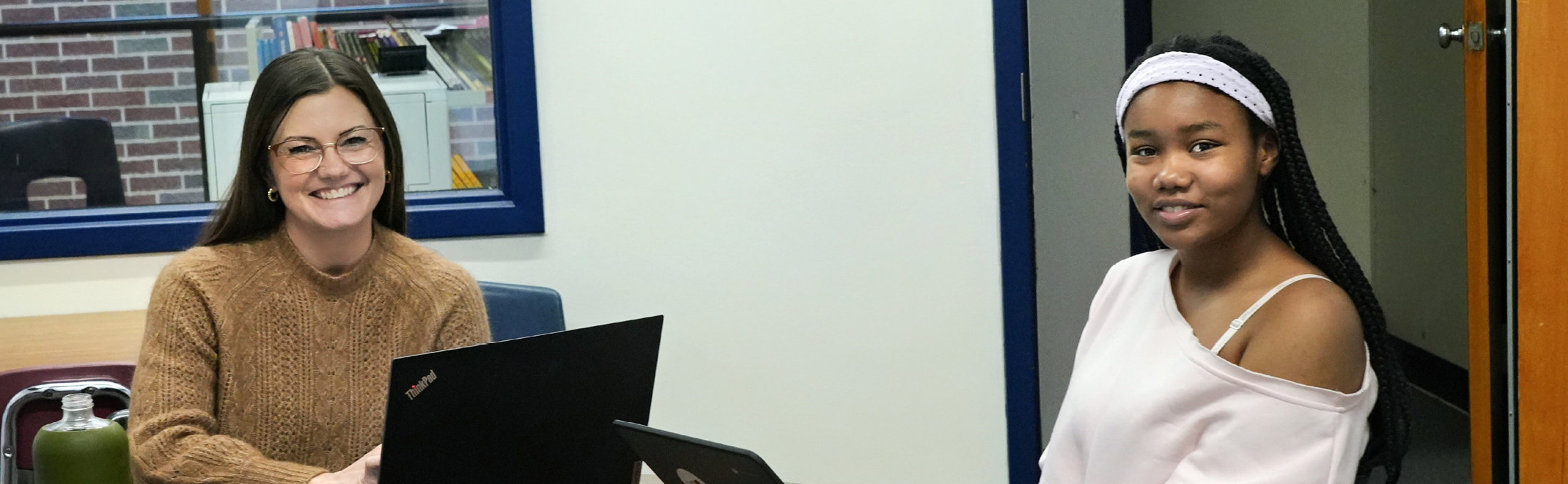 Student and teacher in writing lab