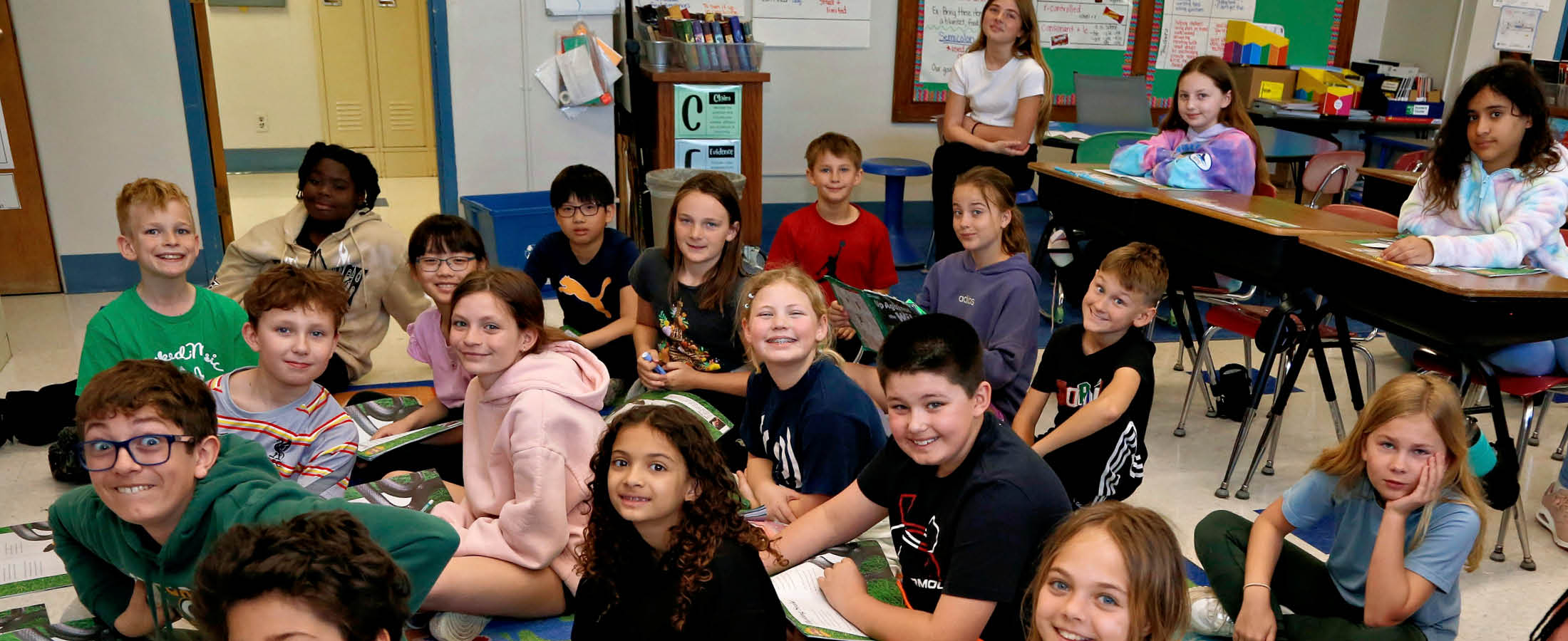 Students listening to book