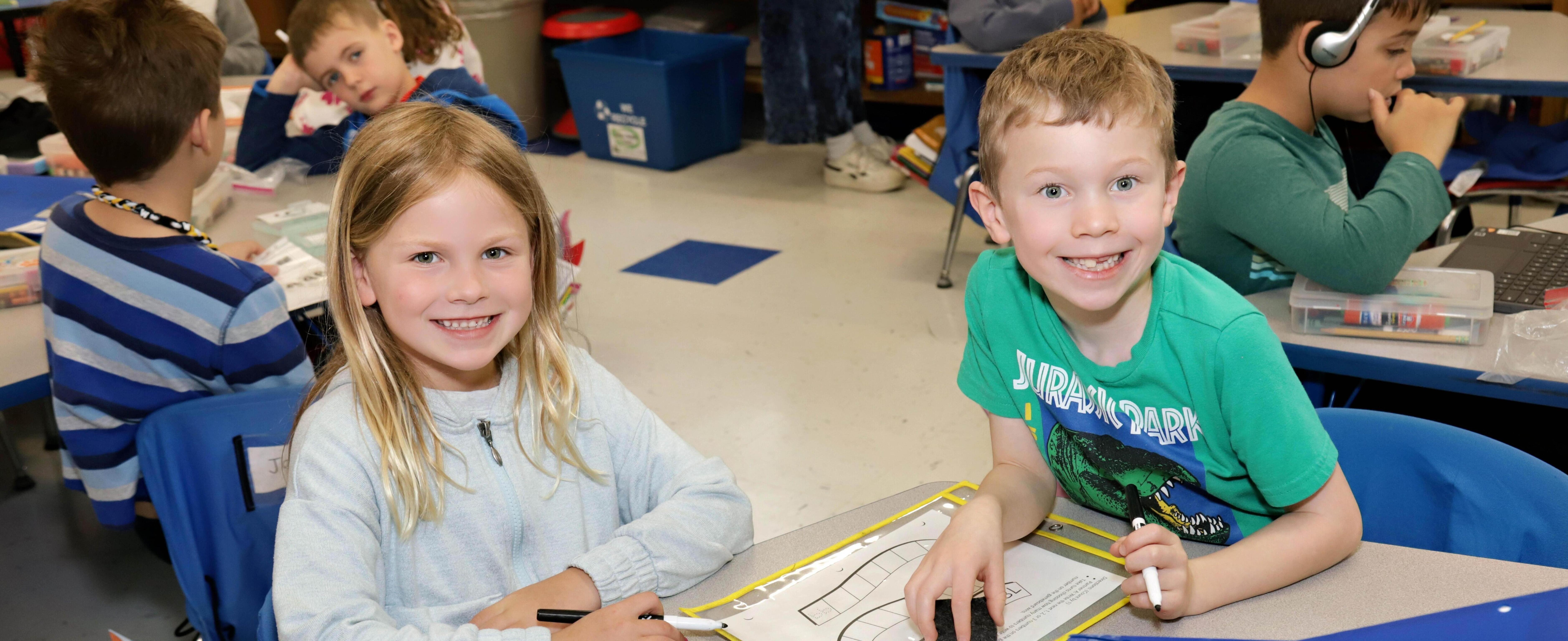 Two students at desks
