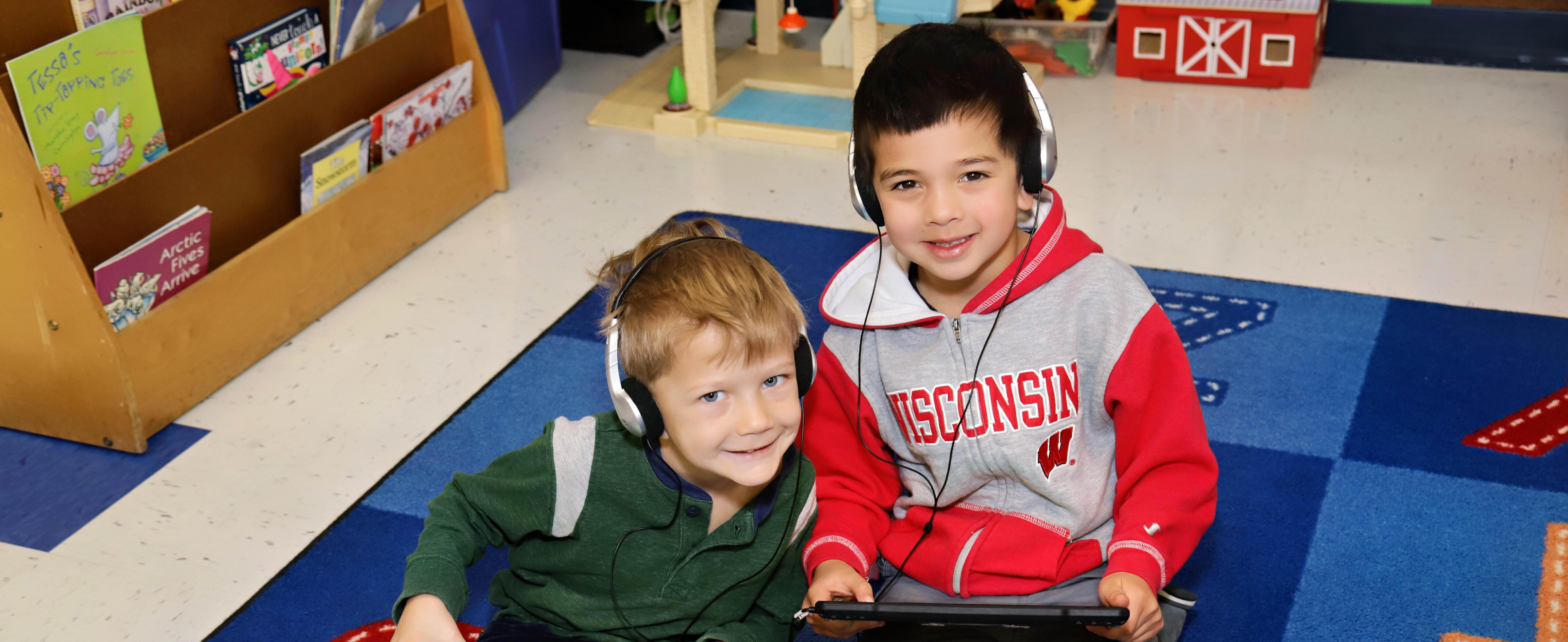 Two students working with technology