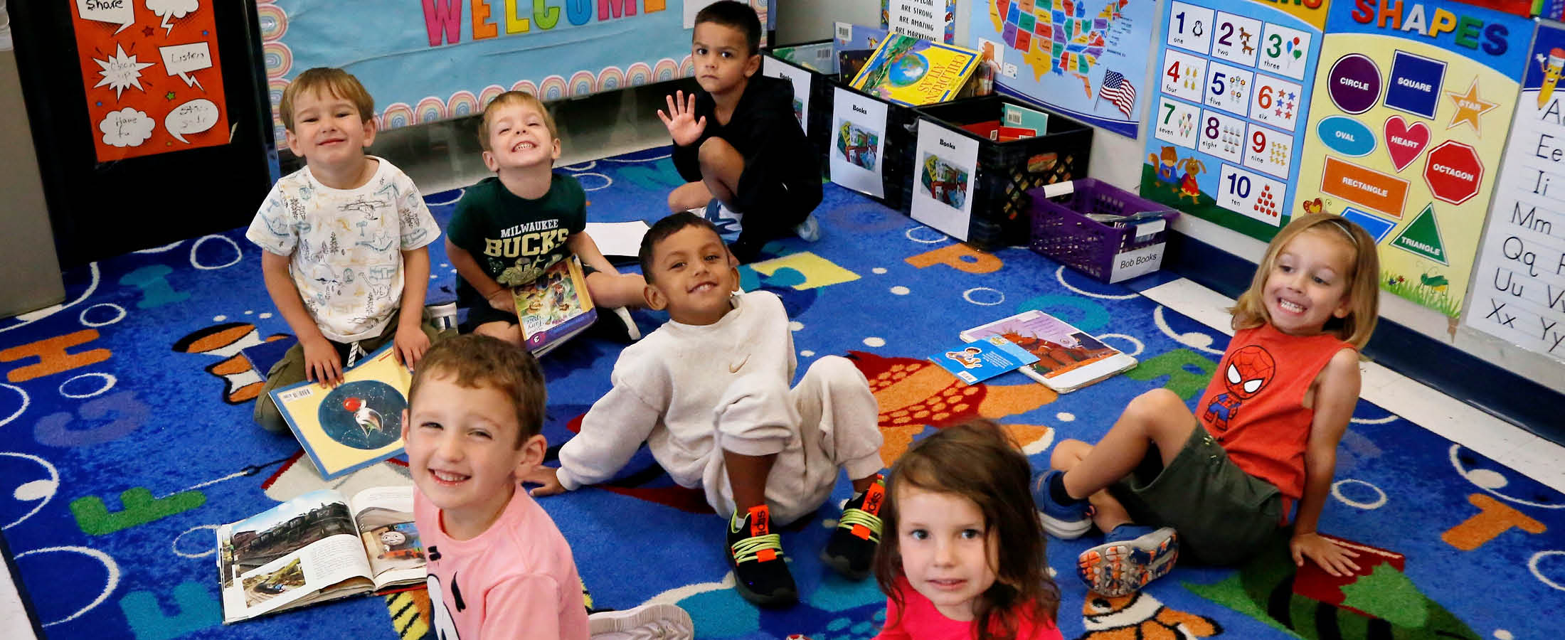 Connects students on a rug