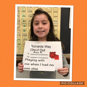 student holding sign