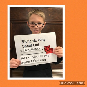 student holding sign