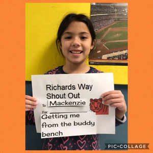 student holding sign