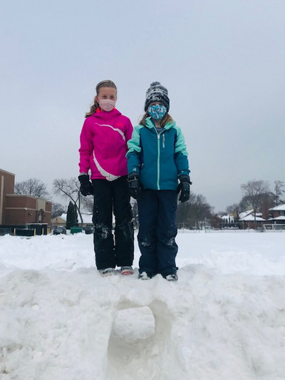 students at recess in the snow