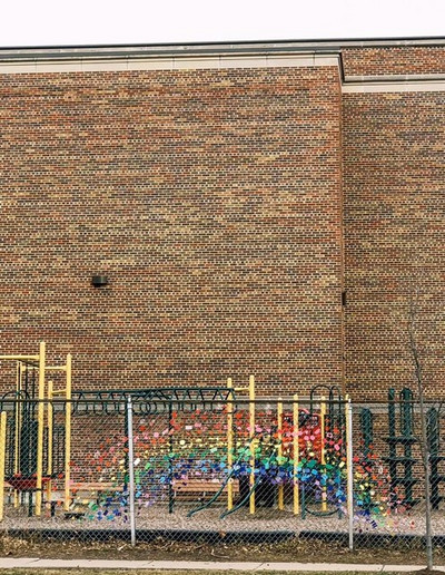 student artwork, rainbow on fence