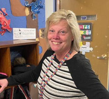 Teacher outside her classroom